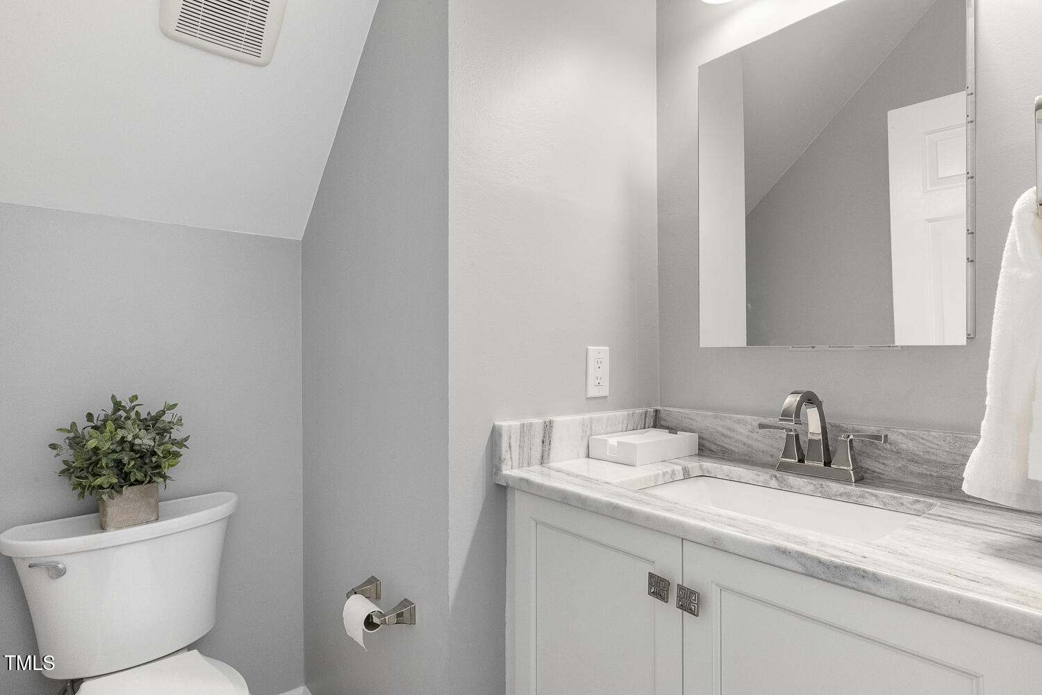 110 Felspar Way Cary, NC 27518 - Photo 25 of 71 a bathroom with a granite countertop sink a toilet and a mirror