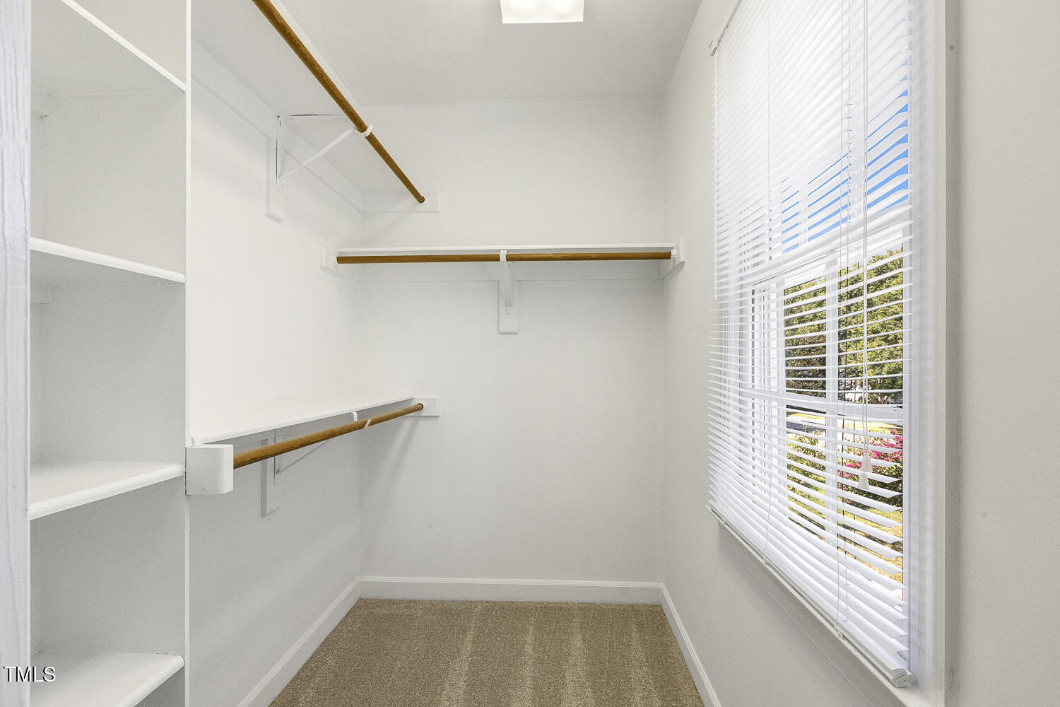 110 Felspar Way Cary, NC 27518 - Photo 30 of 71 a view of a room with rack on the wall and a window