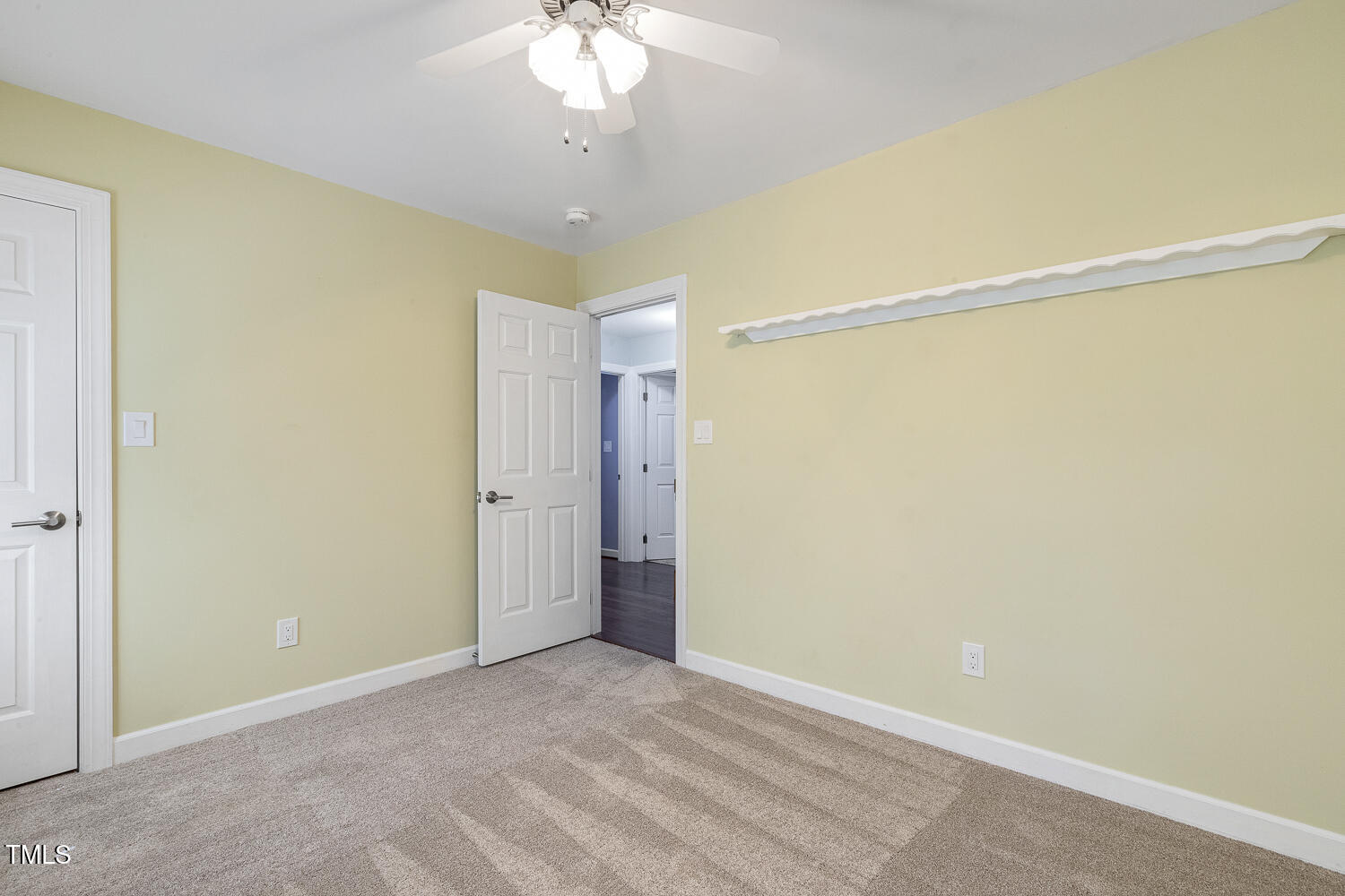 110 Felspar Way Cary, NC 27518 - Photo 36 of 71 a view of an empty room with a chandelier fan