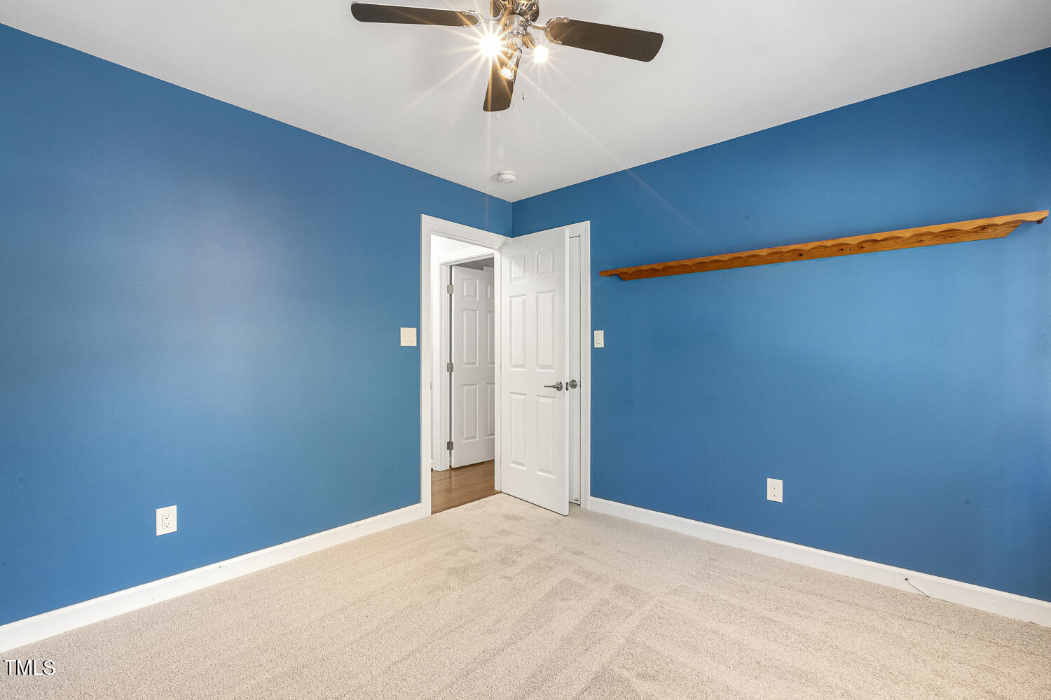 110 Felspar Way Cary, NC 27518 - Photo 39 of 71 a view of a room with a ceiling fan and hardwood floor