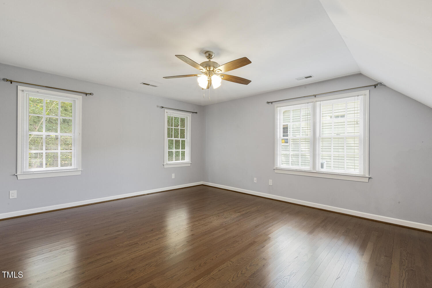 110 Felspar Way Cary, NC 27518 - Photo 41 of 71 a view of a room with wooden floor and a window