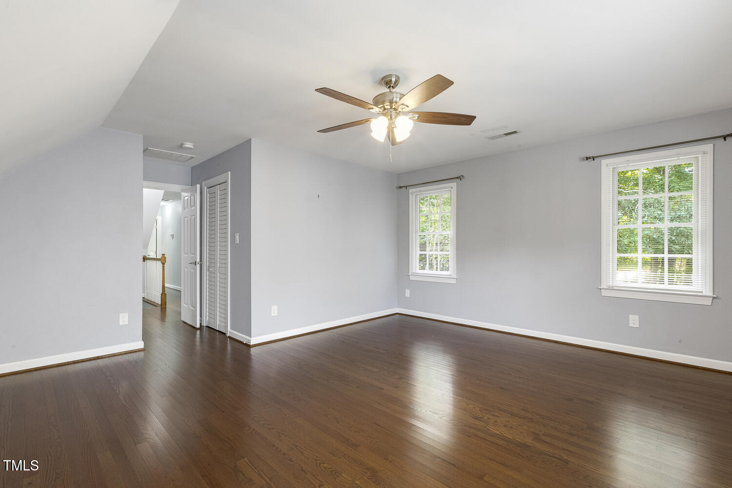 110 Felspar Way Cary, NC 27518 - Photo 42 of 71 a view of an empty room with wooden floor and a window