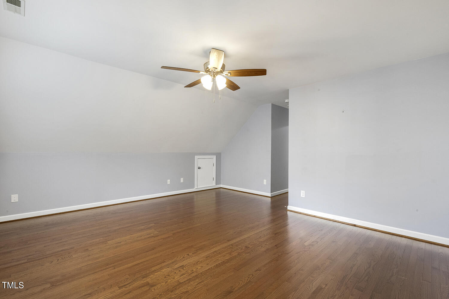 110 Felspar Way Cary, NC 27518 - Photo 43 of 71 wooden floor in an empty room with a window