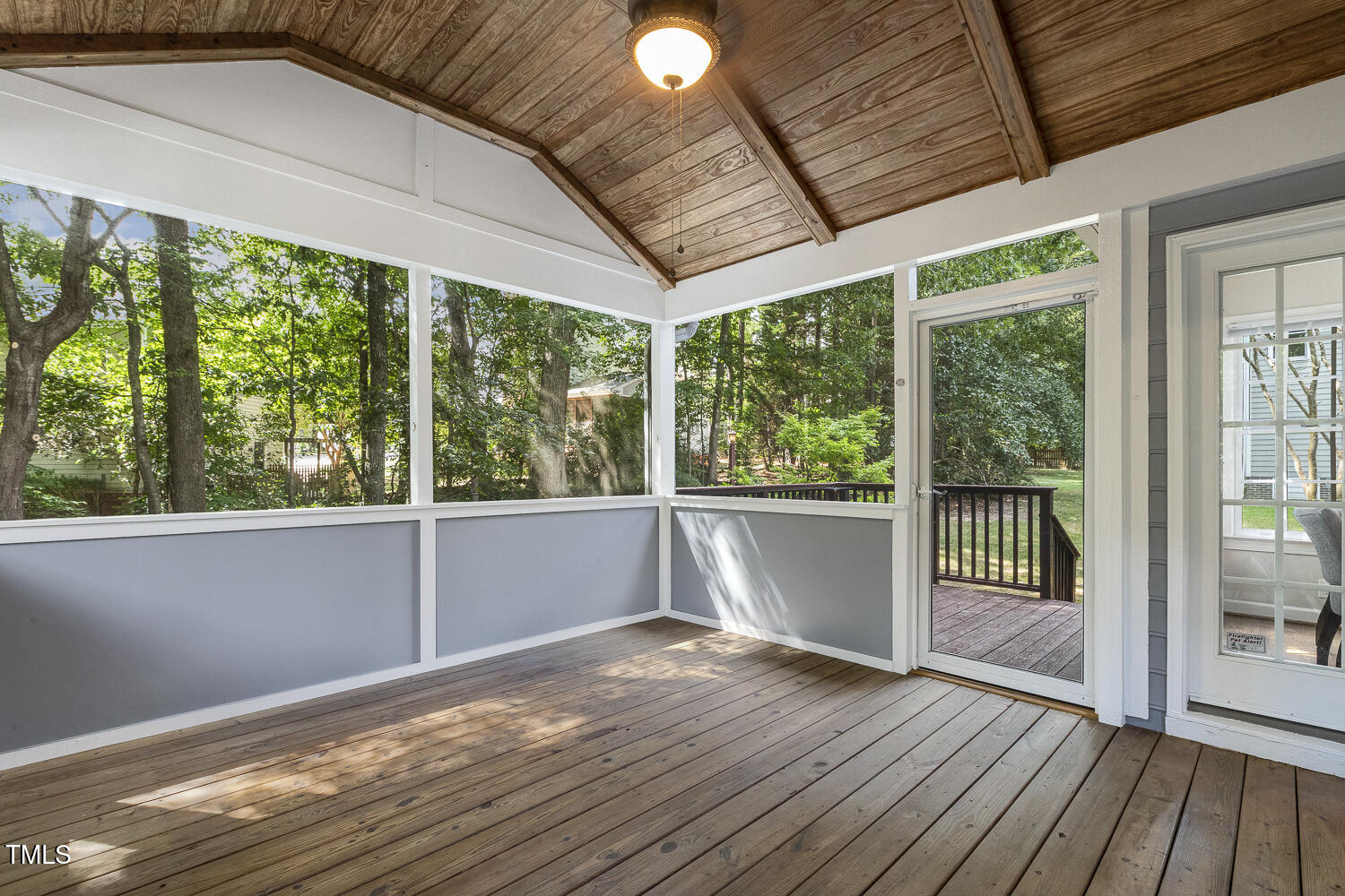 110 Felspar Way Cary, NC 27518 - Photo 50 of 71 a view of backyard with a large window and wooden floor