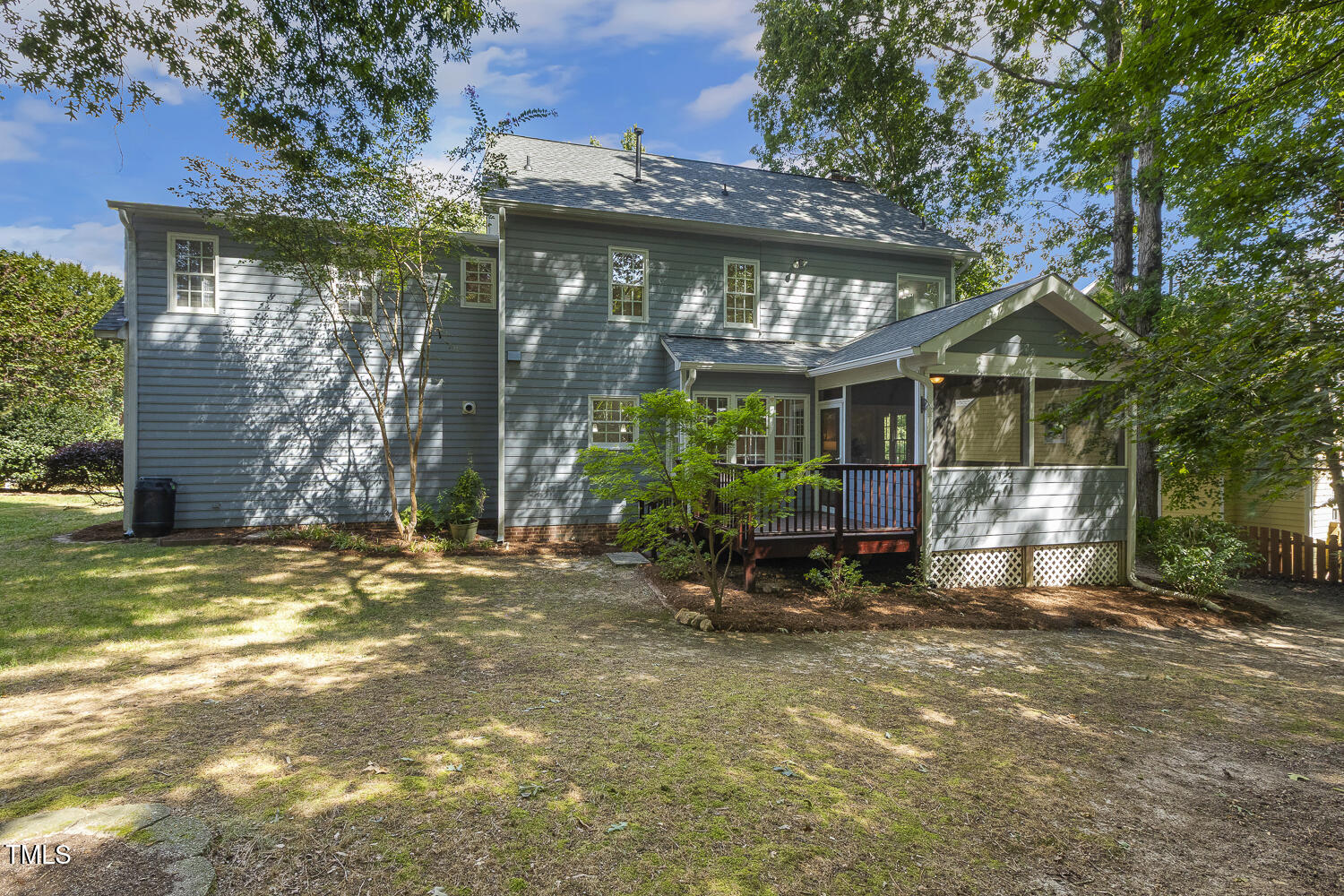 110 Felspar Way Cary, NC 27518 - Photo 59 of 71 a view of a house with large windows and a small yard