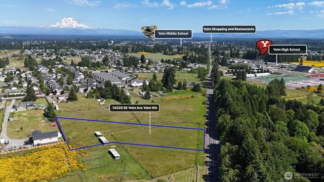 an aerial view of a house with a swimming pool