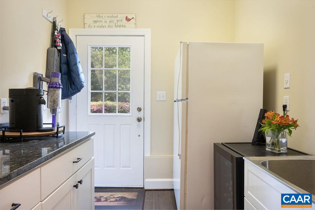 25 Bolling Circle Palmyra, VA 22963 - Photo 15 of 45 a bathroom with a granite countertop sink a mirror and a shower