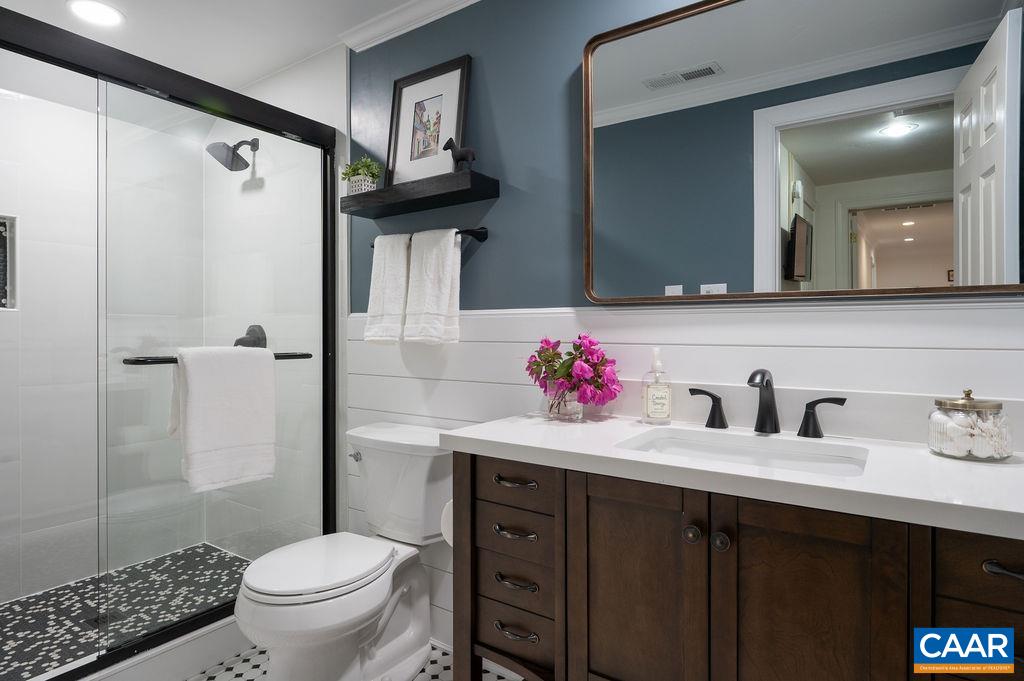 25 Bolling Circle Palmyra, VA 22963 - Photo 25 of 45 a bathroom with a sink toilet and shower