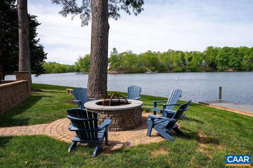 25 Bolling Circle Palmyra, VA 22963 - Photo 29 of 45 a view of a backyard with plants and a lake