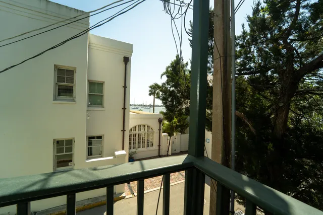 a view of a porch with wooden floor
