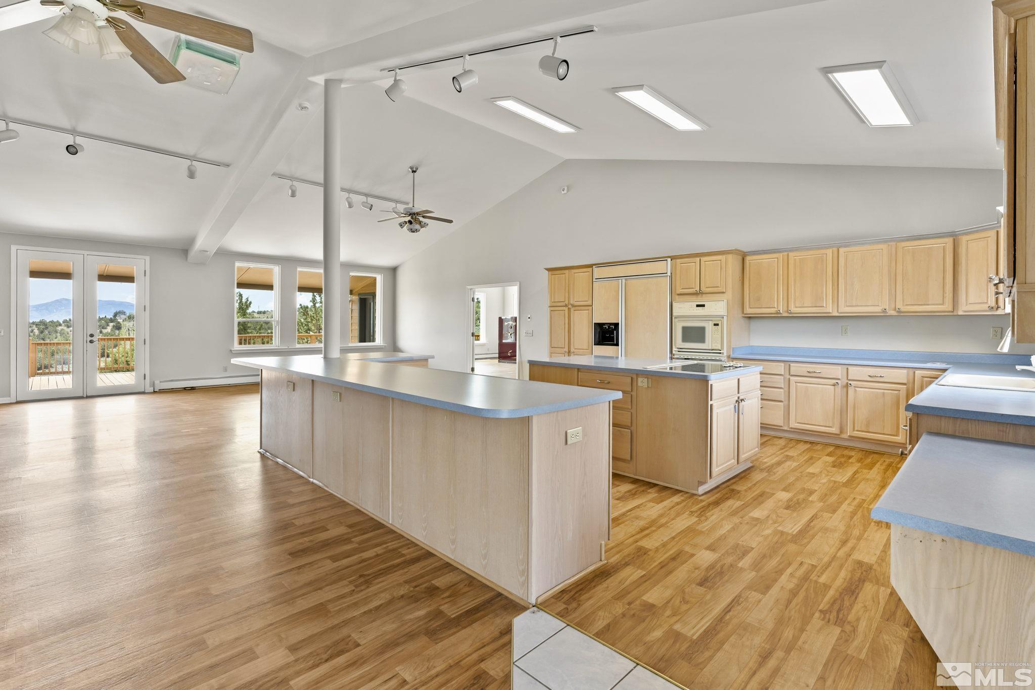 1220 Argosy Road Reno, NV 89508 - Photo 7 of 40 a large kitchen with lots of counter space a sink and appliances