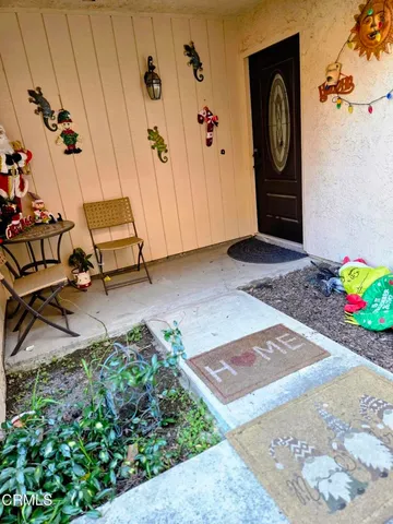 a view of a entryway door with wooden floor
