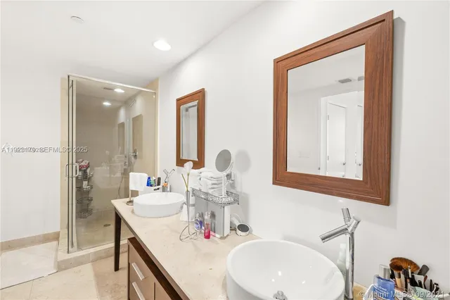 a bathroom with a double vanity sink and a mirror