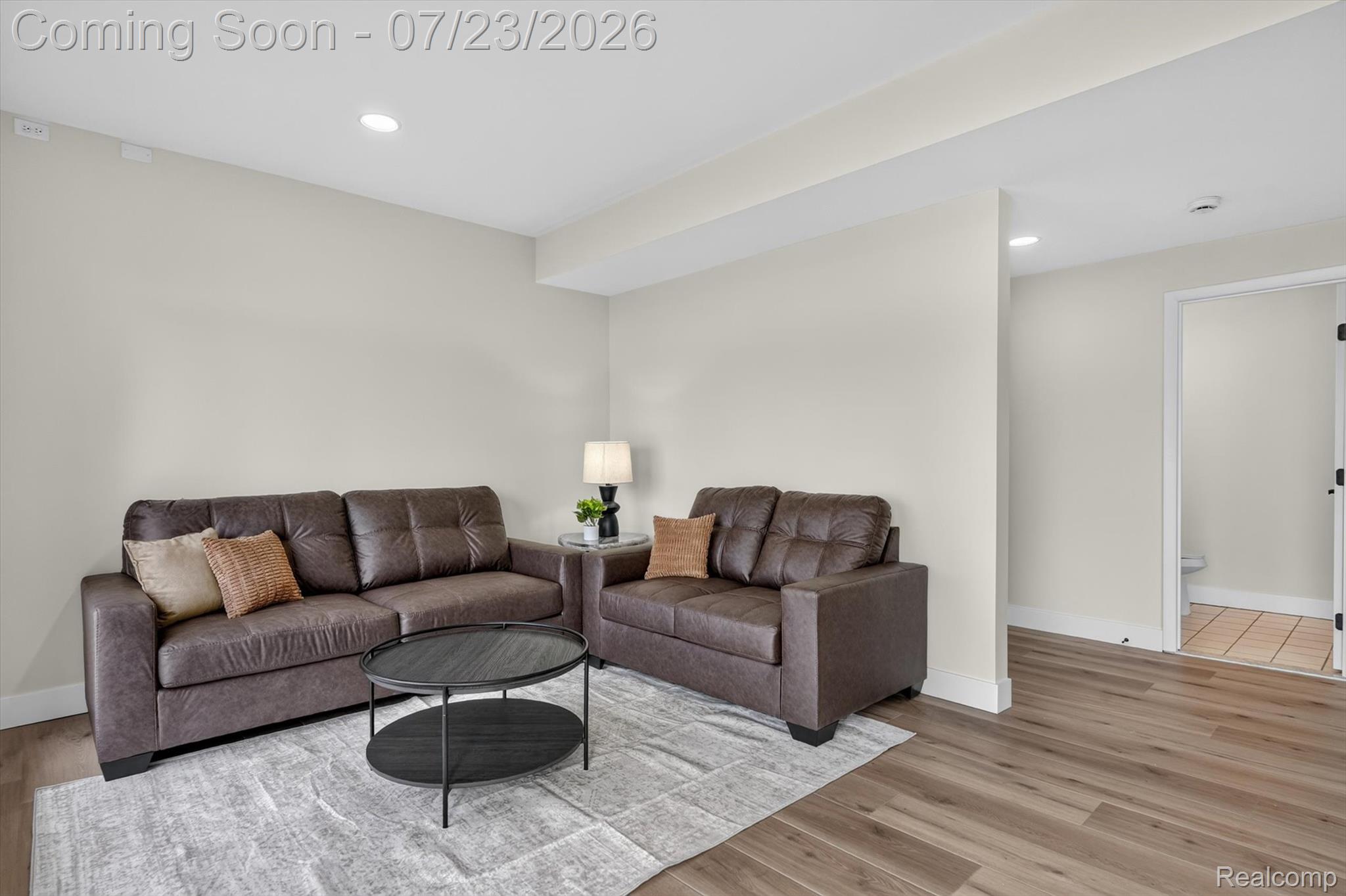 3429 Rolston Road Fenton, MI 48430 - Photo 36 of 62 Open-concept living area featuring wood-finish flooring, recessed lighting, and crisp white trim