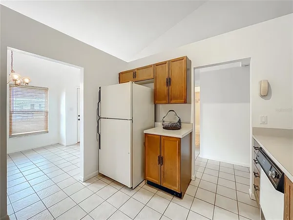 a view of a kitchen with refrigerator and stove