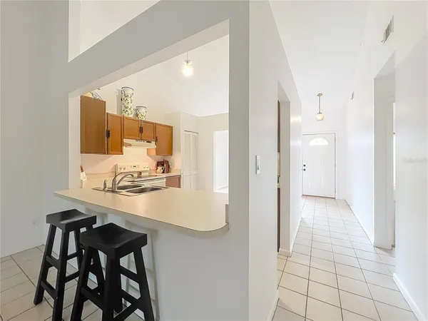 a view of kitchen island dining table and chairs