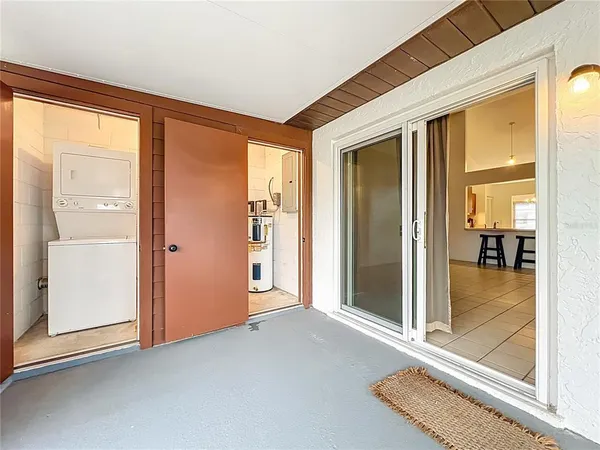 hallway with wooden floor and windows