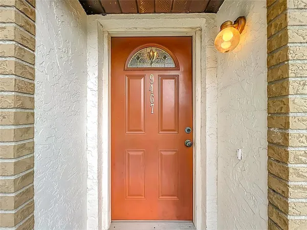 a view of a entryway door with wooden floor