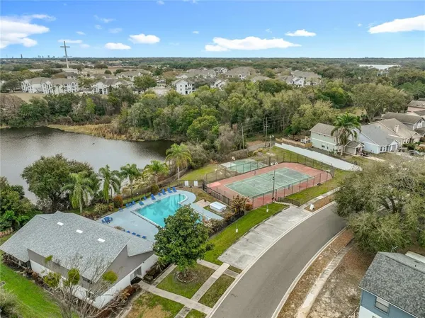 an aerial view of a house with a lake view