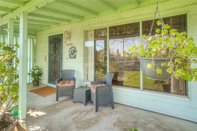 a outdoor space with patio couch and glass door