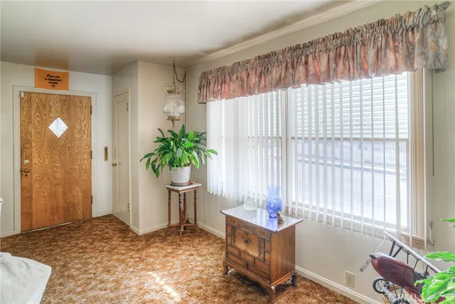 a view of an empty room and window