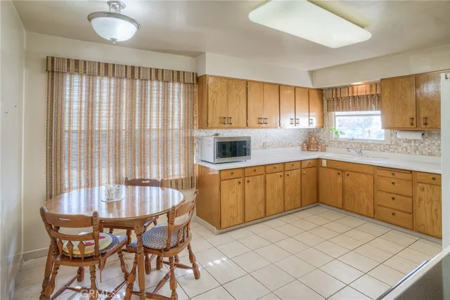 a kitchen with a wooden cabinets and white appliances