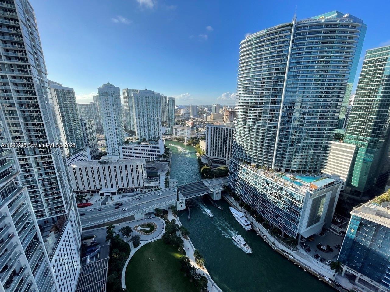 Icon Brickell Miami, FL 33131 - Photo 5 of 12 a view of roof deck with wooden floor and city view