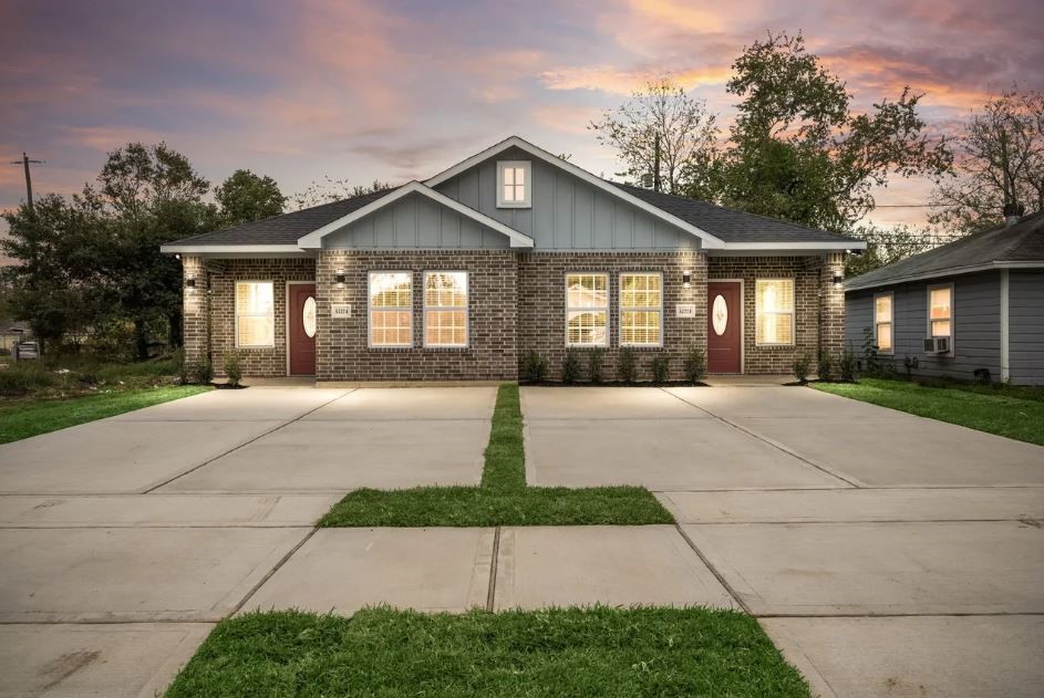 Breathtaking twilight exterior highlighting upscale architecture, warm lighting, and luxurious evening curb appeal.