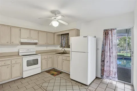 a view of a backyard with a swimming pool