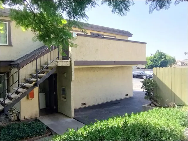 a kitchen with stainless steel appliances granite countertop a refrigerator a stove a sink and a microwave