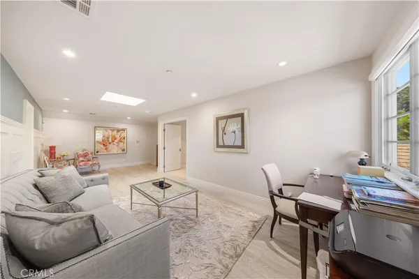 a bathroom with a sink a toilet a tub and a window