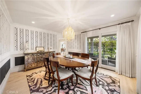 a kitchen with stainless steel appliances granite countertop a lot of cabinets and wooden floor