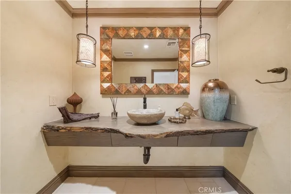 a bedroom with a bed and a refrigerator