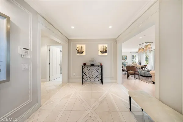 a living room with furniture and a stairs