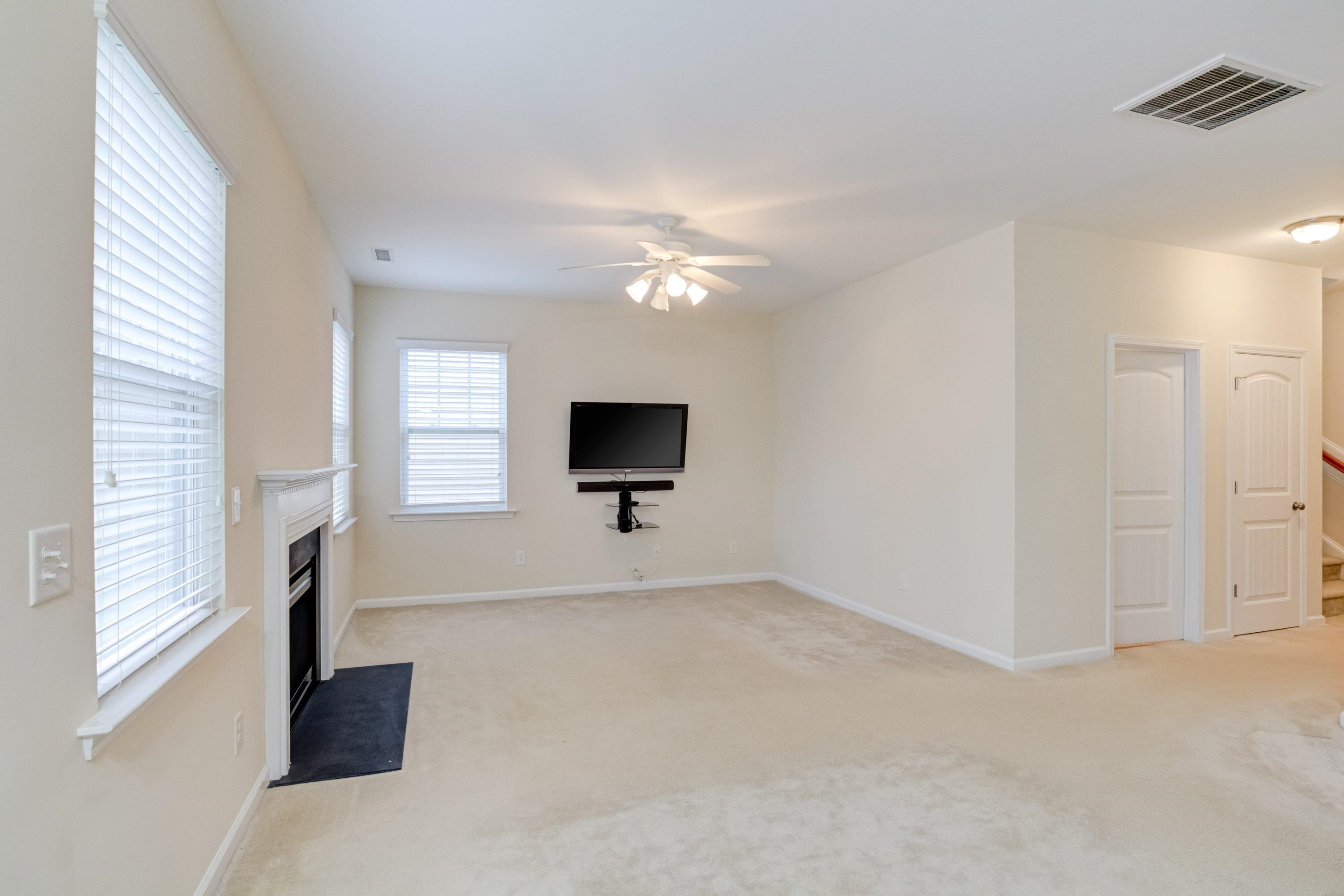 409 Birchrun Drive Durham, NC 27712 - Photo 13 of 49 a living room with furniture and a flat screen tv