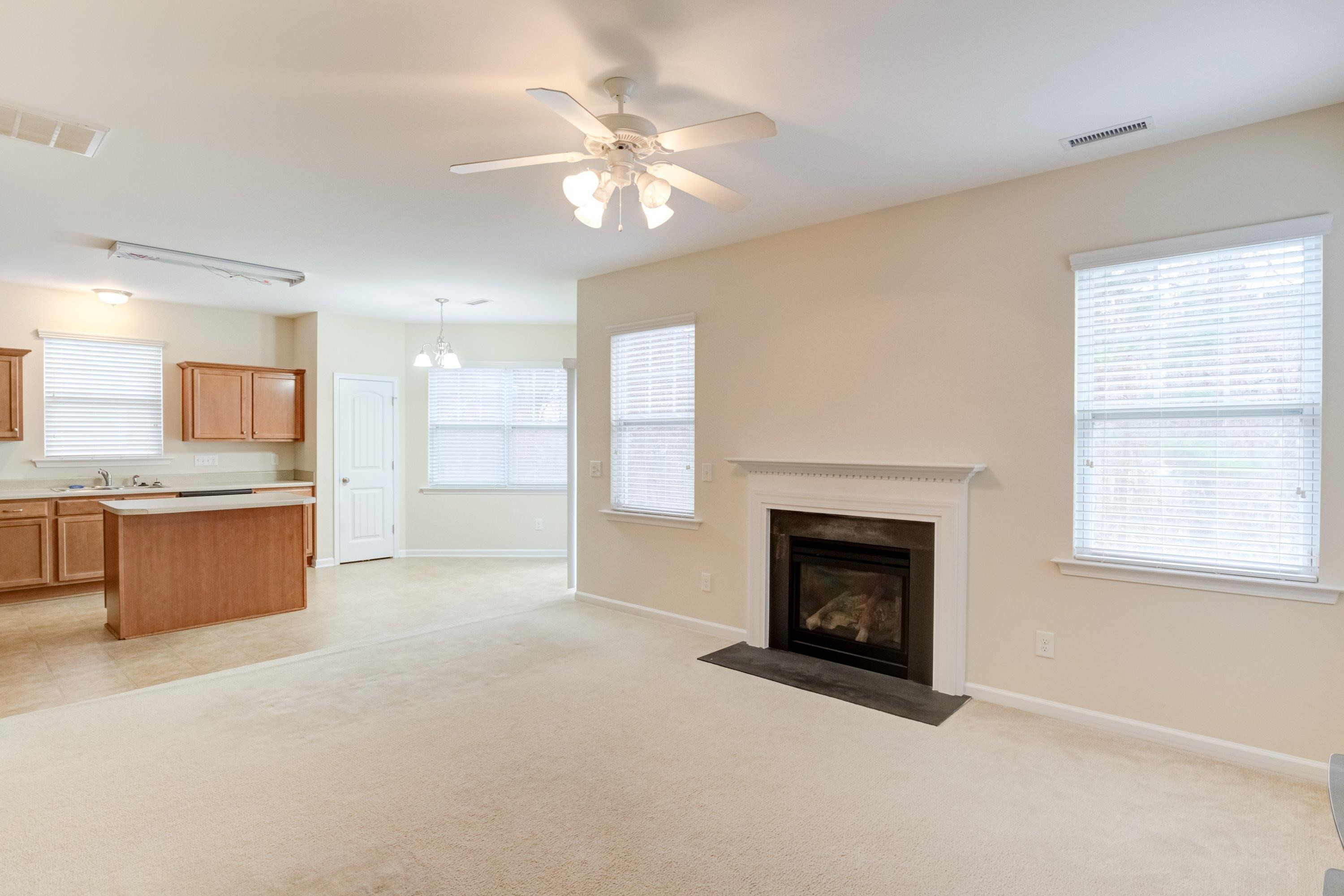 409 Birchrun Drive Durham, NC 27712 - Photo 15 of 49 a view of an empty room with a fireplace and a window