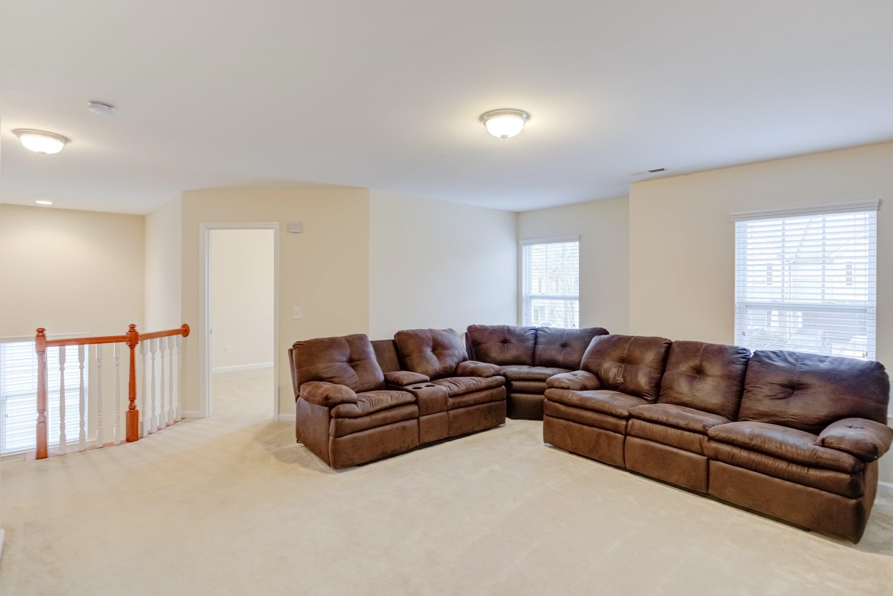 409 Birchrun Drive Durham, NC 27712 - Photo 26 of 49 a living room with furniture and a couch