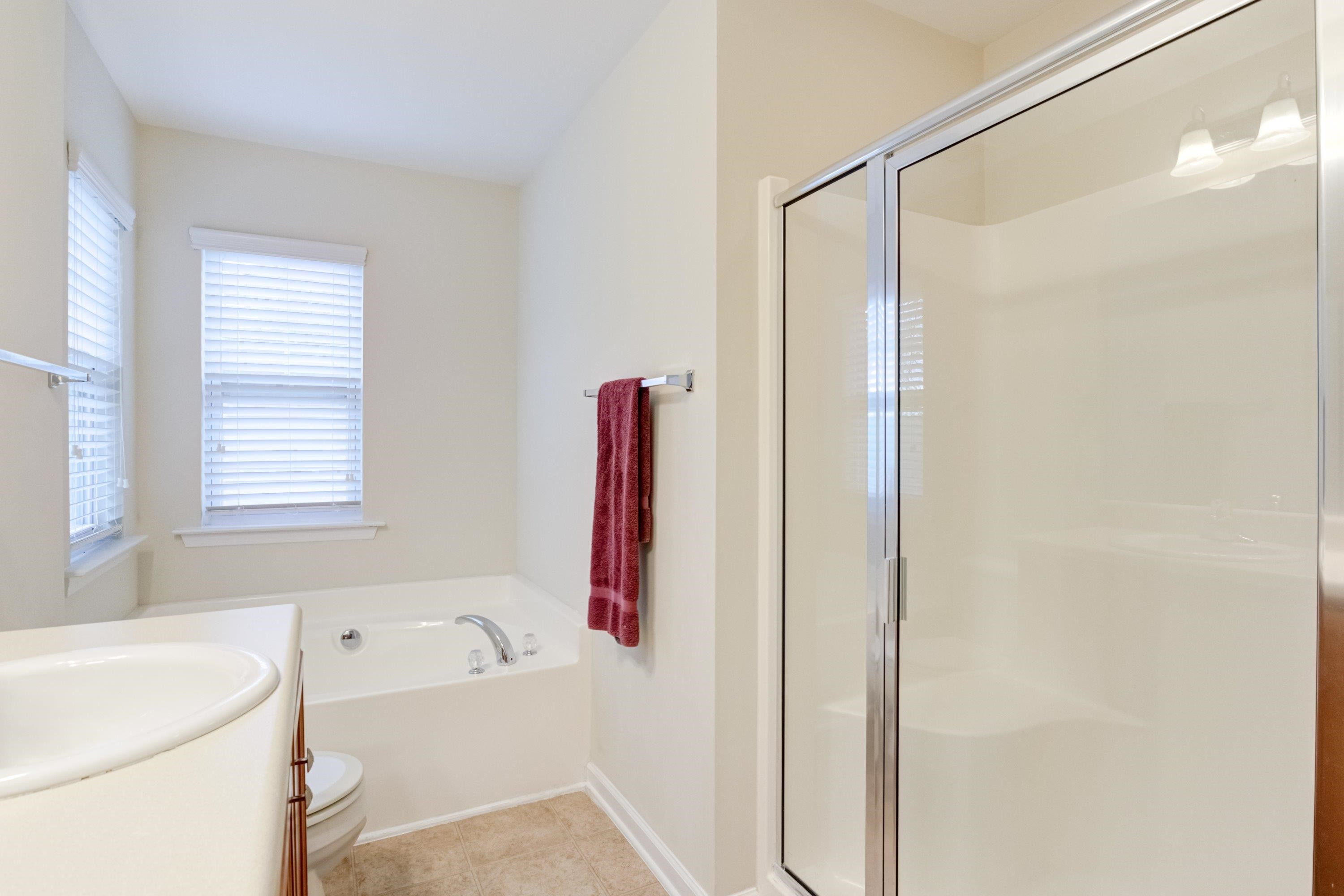 409 Birchrun Drive Durham, NC 27712 - Photo 33 of 49 a bathroom with a tub and a shower