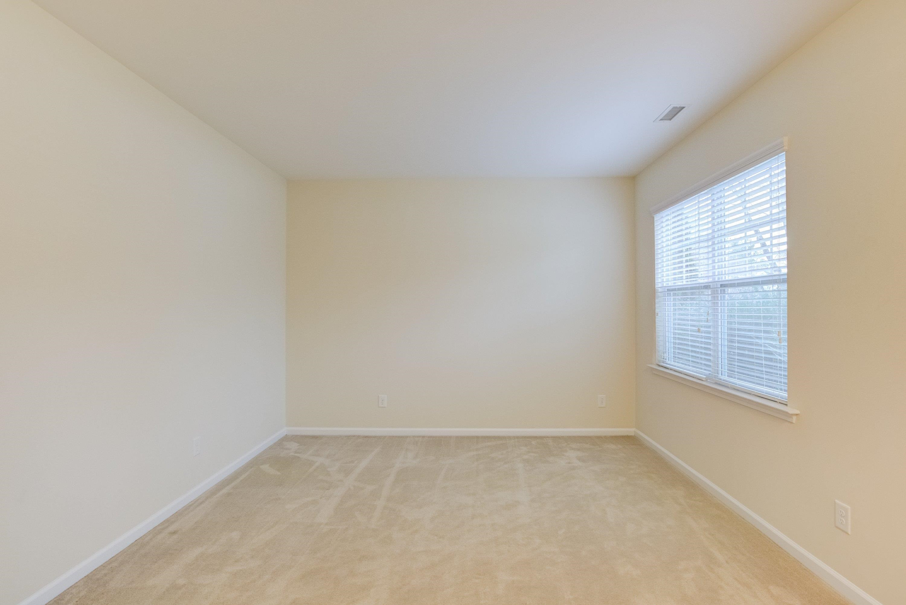 409 Birchrun Drive Durham, NC 27712 - Photo 35 of 49 an empty room with a window