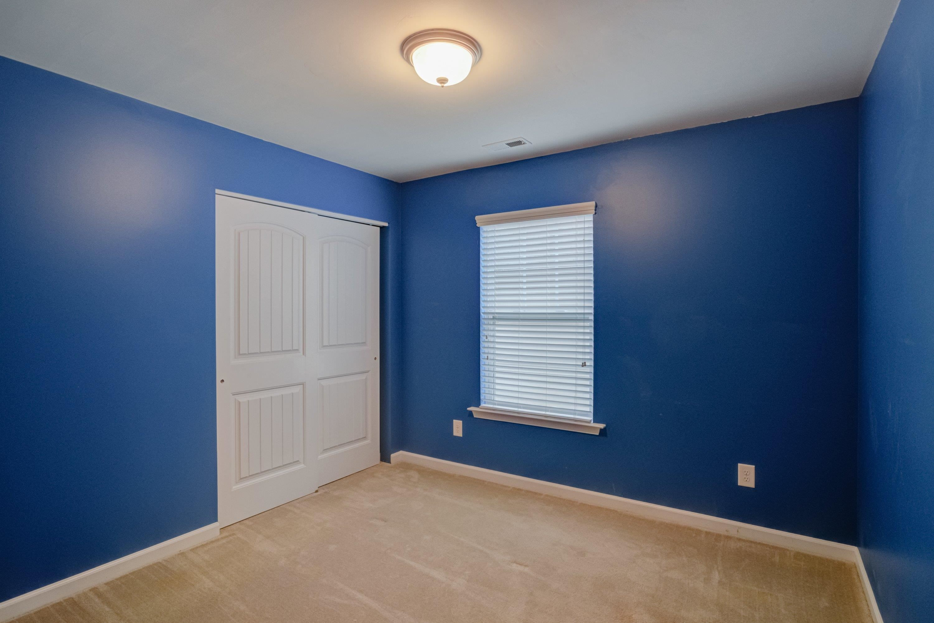 409 Birchrun Drive Durham, NC 27712 - Photo 37 of 49 an empty room with windows
