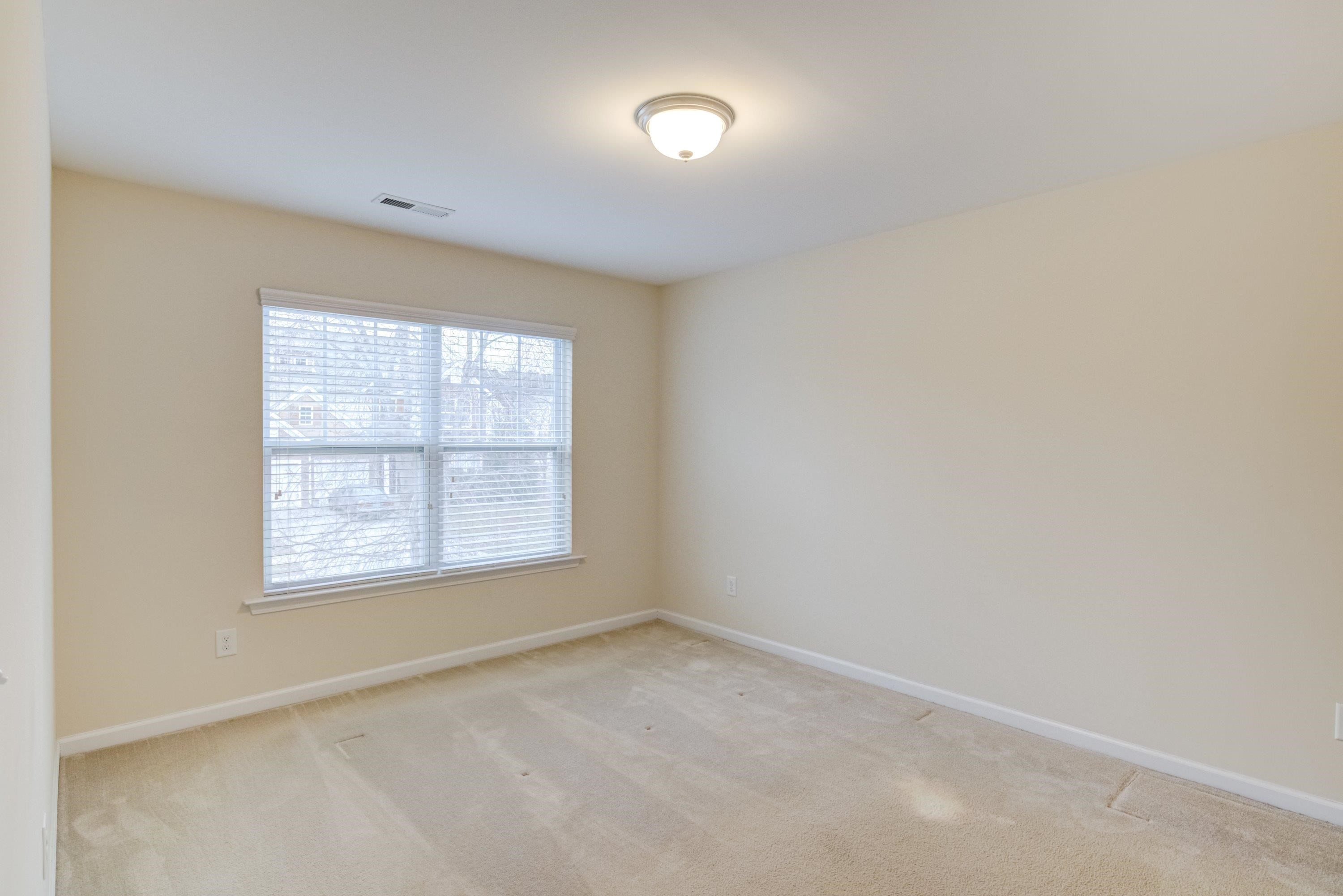 409 Birchrun Drive Durham, NC 27712 - Photo 41 of 49 an empty room with a window