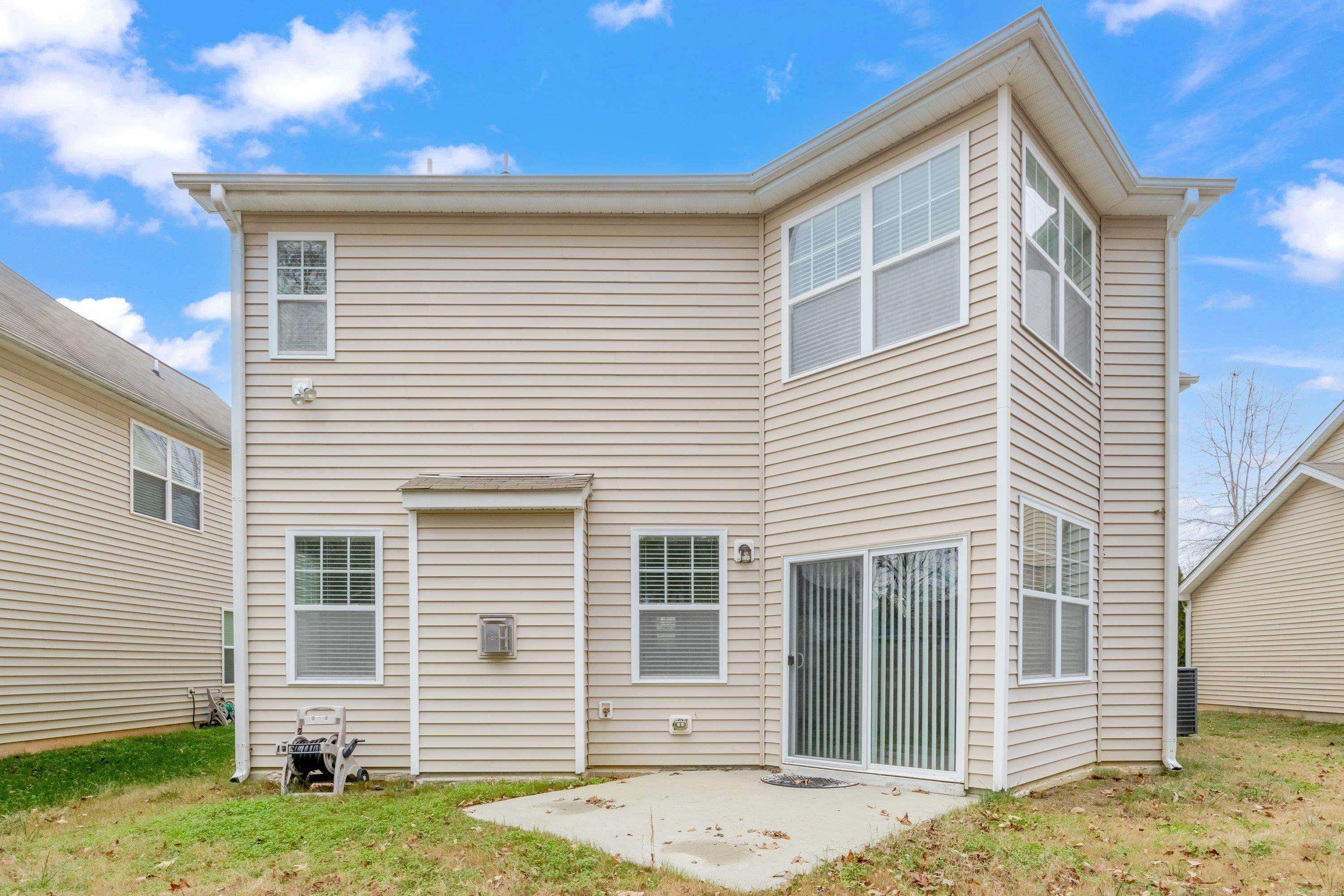409 Birchrun Drive Durham, NC 27712 - Photo 45 of 49 a view of a house with a yard