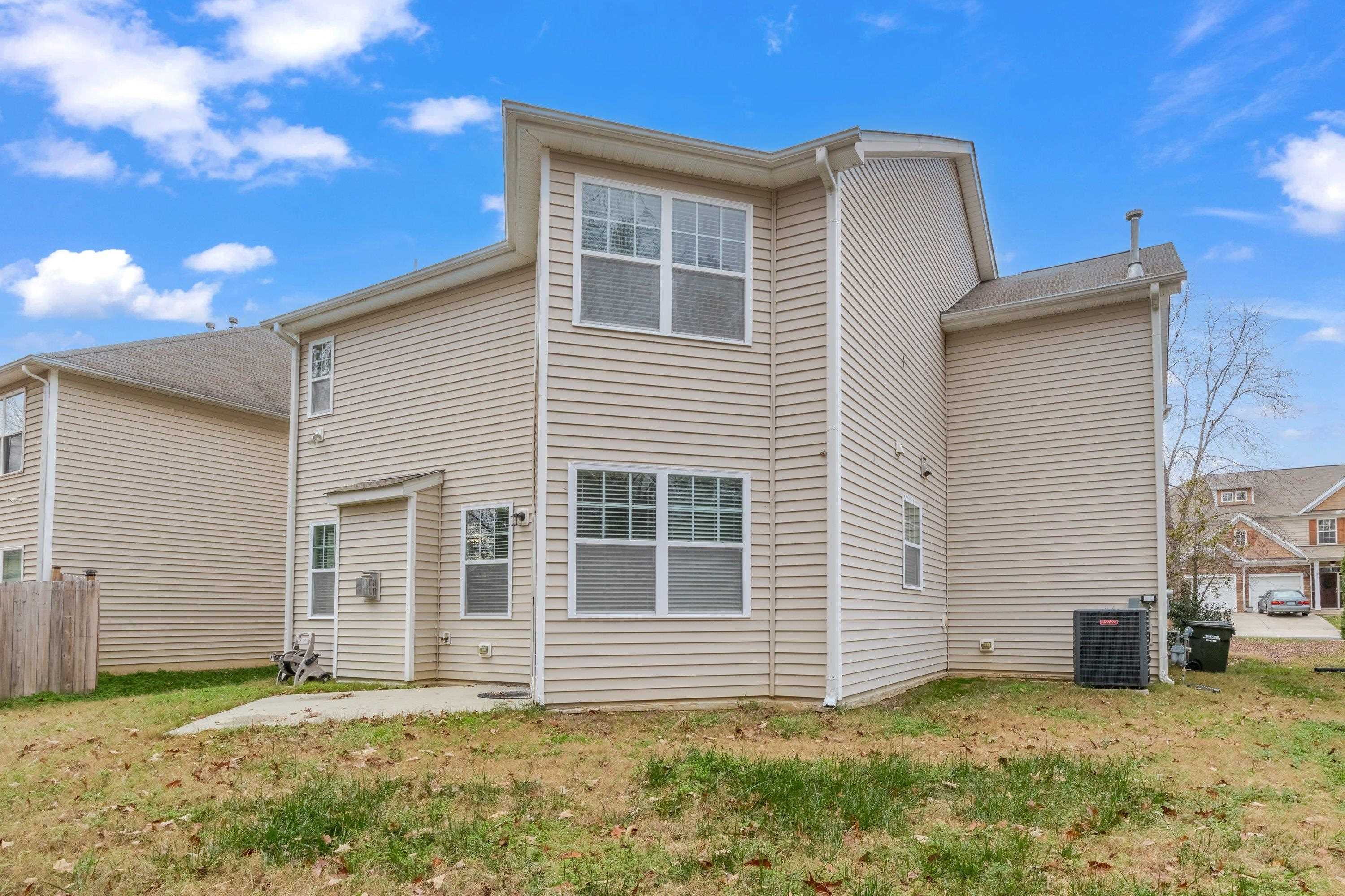 409 Birchrun Drive Durham, NC 27712 - Photo 47 of 49 a view of a house with a yard