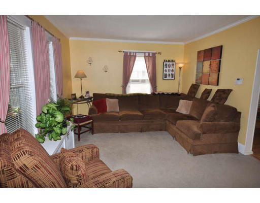 39 Inverness Road Arlington, MA 02476 - Photo 11 of 19 a living room with furniture and a large window