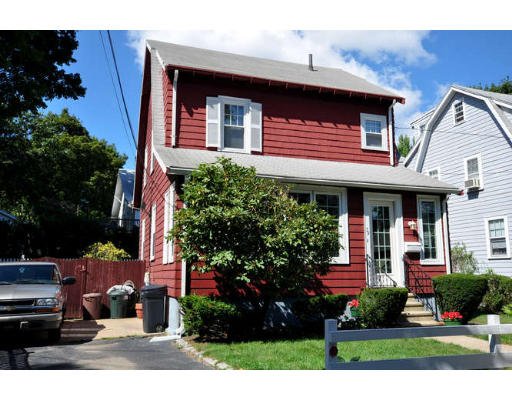 39 Inverness Road Arlington, MA 02476 - Photo 18 of 19 a view of a house with brick walls and potted plants