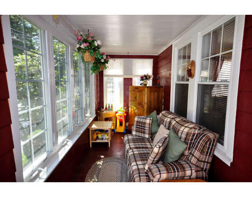 39 Inverness Road Arlington, MA 02476 - Photo 2 of 19 a living room with furniture and a large window