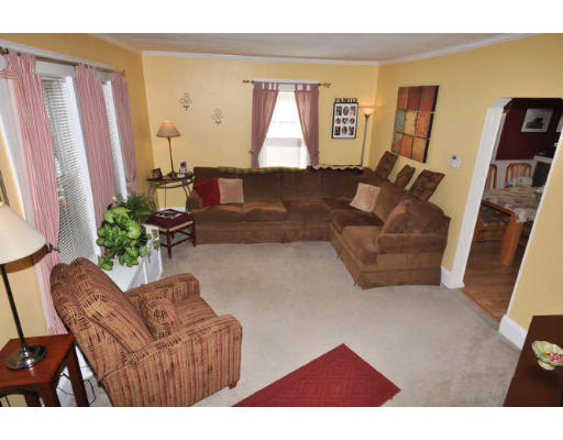 39 Inverness Road Arlington, MA 02476 - Photo 3 of 19 a living room with furniture and a large window