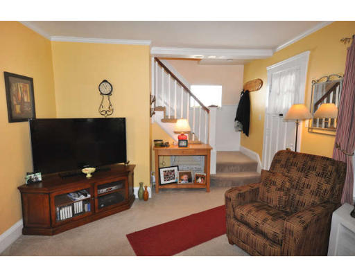 39 Inverness Road Arlington, MA 02476 - Photo 4 of 19 a living room with furniture and a flat screen tv