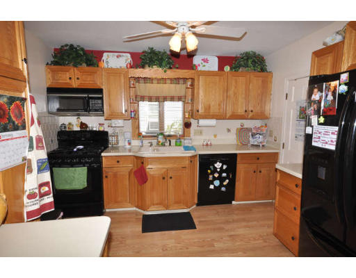 39 Inverness Road Arlington, MA 02476 - Photo 5 of 19 a kitchen with stainless steel appliances kitchen island granite countertop a refrigerator a stove top oven and a sink