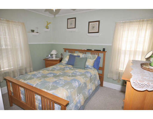39 Inverness Road Arlington, MA 02476 - Photo 8 of 19 a bedroom with a bed and a dresser in it